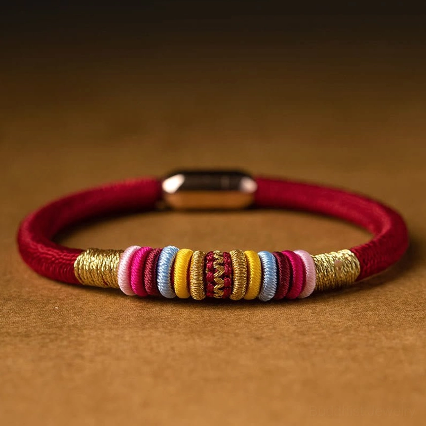 Close-up macro detail of king kong knot bracelet beads and gold magnetic clasp