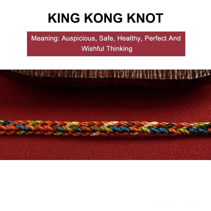 King Kong knot detail on multicolor braided Buddhist protection bracelet with meaning text on dark wooden background