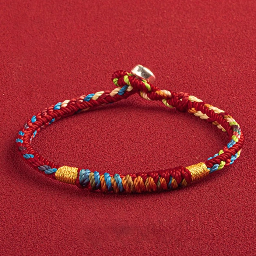 Multicolored Buddhist protection bracelet with King Kong Knot symbol and red five-color thread for luck and spiritual connection