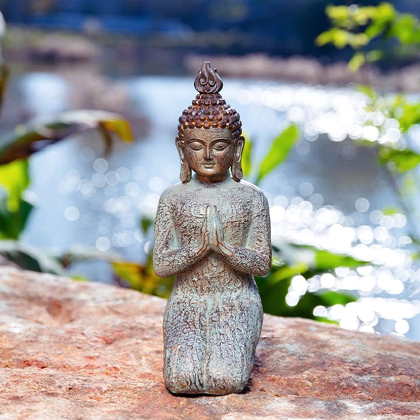 Kneeling Buddha statue in devotional pose, large handcrafted resin meditation figurine for sacred spaces