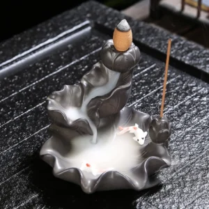 Koi fish backflow incense burner ceramic lotus design with flowing smoke on wooden tea tray