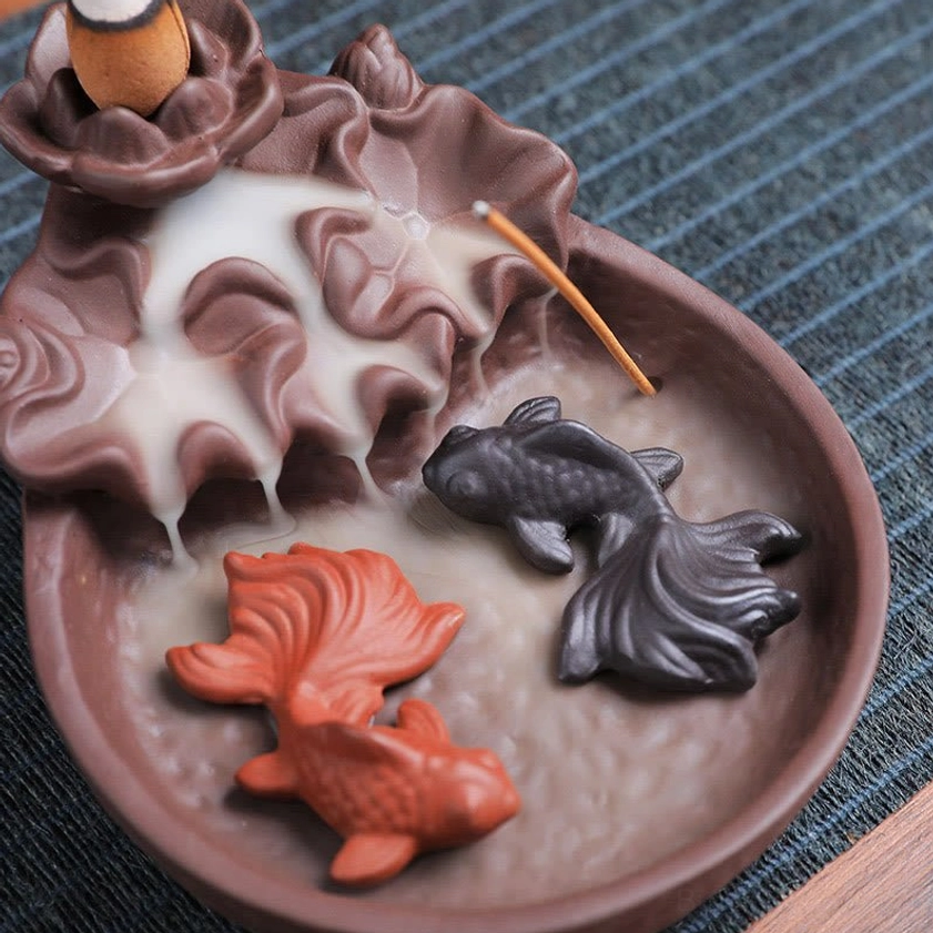 Handcrafted koi fish ceramic incense holder showing intricate design details and premium purple clay quality