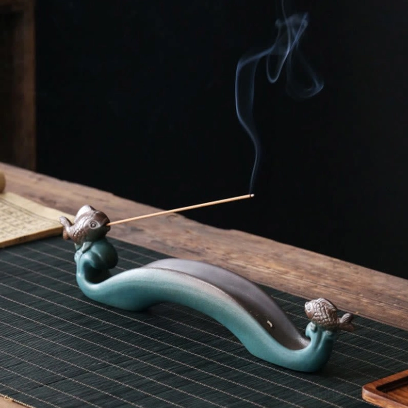 Double Koi Fish incense holder showing front oblique view with rising incense smoke