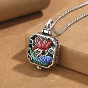 Koi fish lotus copper prayer box necklace pendant - three-quarter close-up side view showing enamel details and filigree metalwork