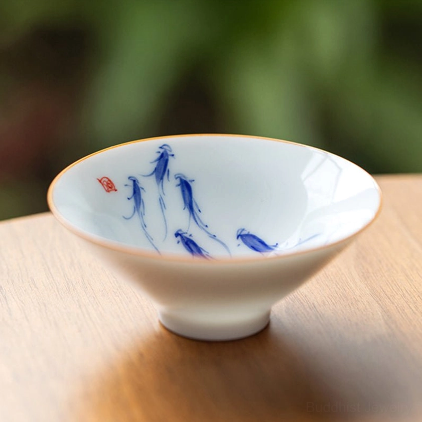 Koi fish swimming pattern porcelain teacup Buddhist symbolism hand-painted ceramic with red seal