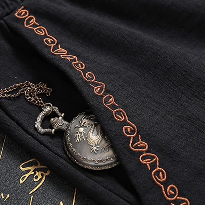Tang suit pants side trim with orange embroidered accents and vintage pocket watch ornament detail