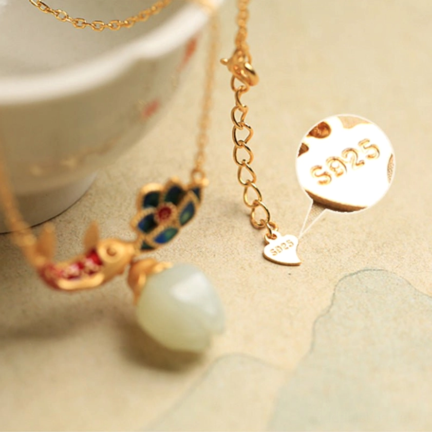 Handmade koi fish lotus jade necklace with S925 sterling silver stamp and heart-shaped brand tag showing full pendant details