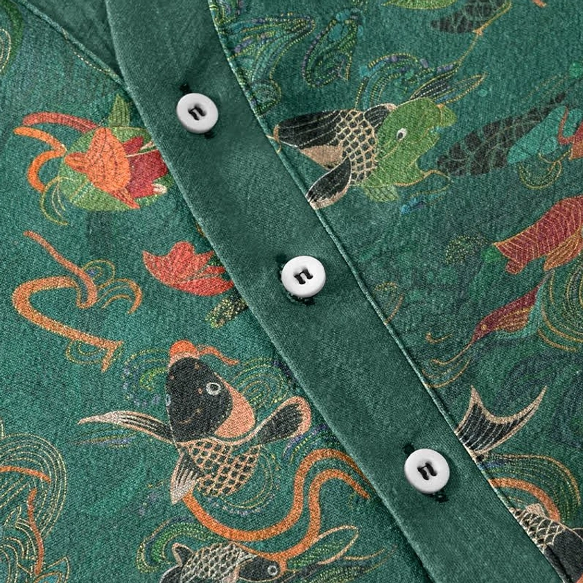 Half-button placket detail on mens koi lotus shirt showing white buttons and fine print work