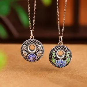 Two styles of 999 sterling silver koi fish fu character lotus peace buckle pendants side by side displaying filigree hollow design