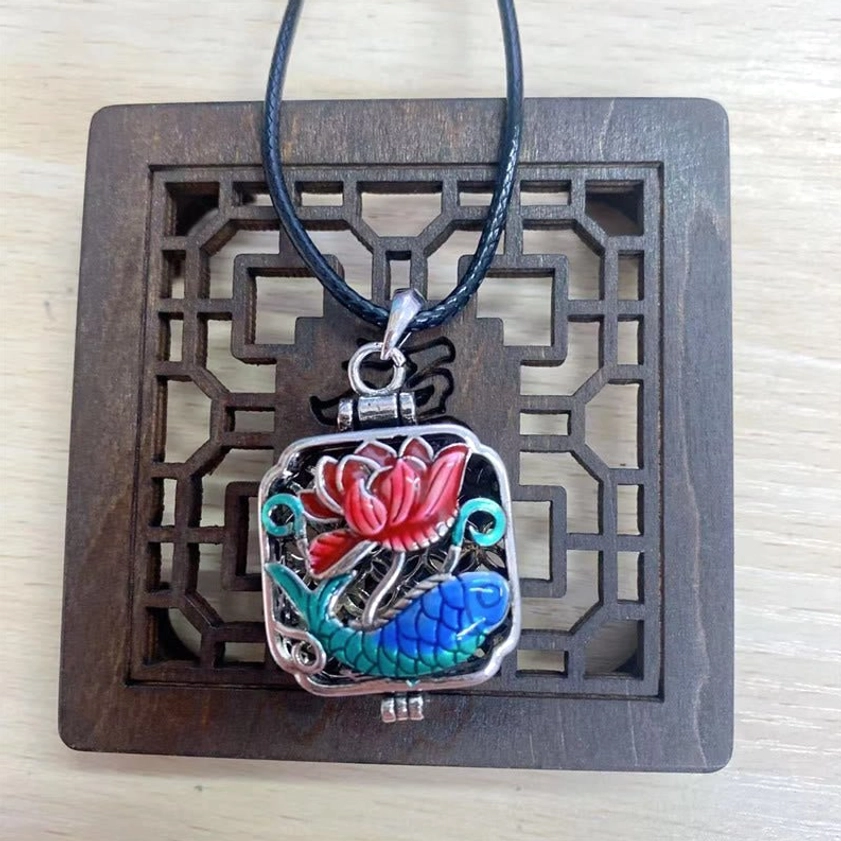 Koi fish lotus pendant on dark blue leather cord - front flat view showing leather strap alternative to chain necklace