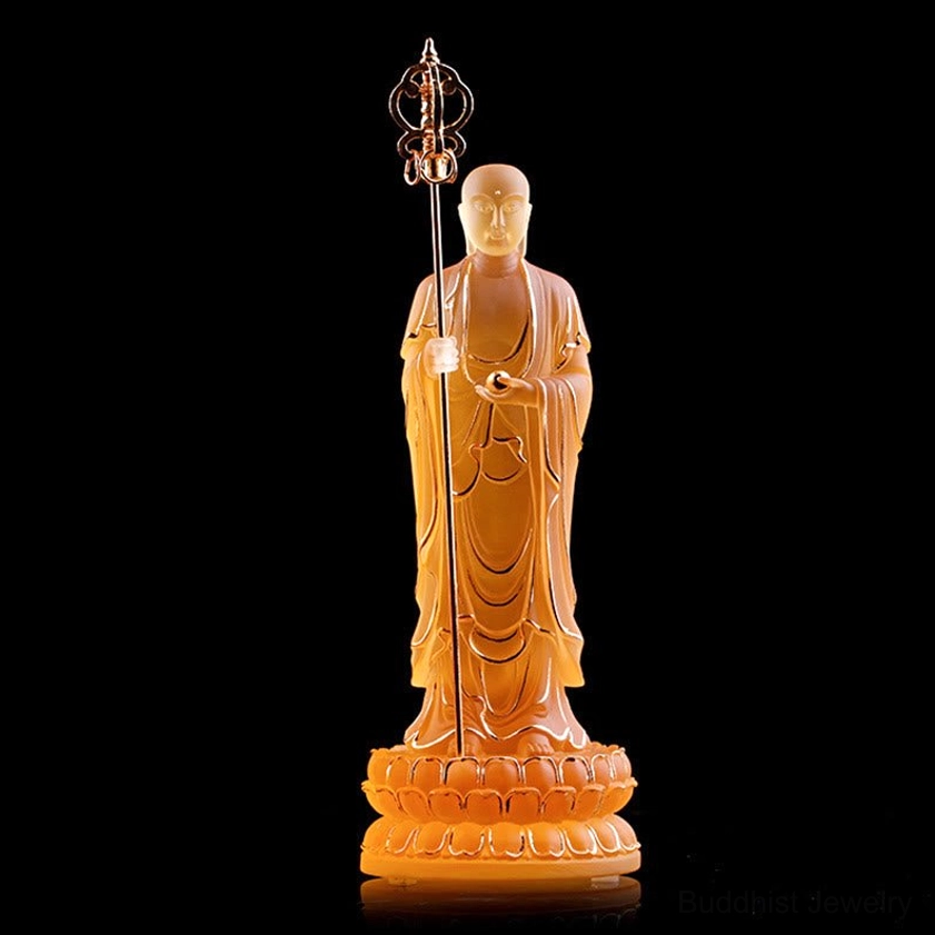 Amber translucent Ksitigarbha Bodhisattva liuli crystal statue with intricate golden khakkhara staff detail