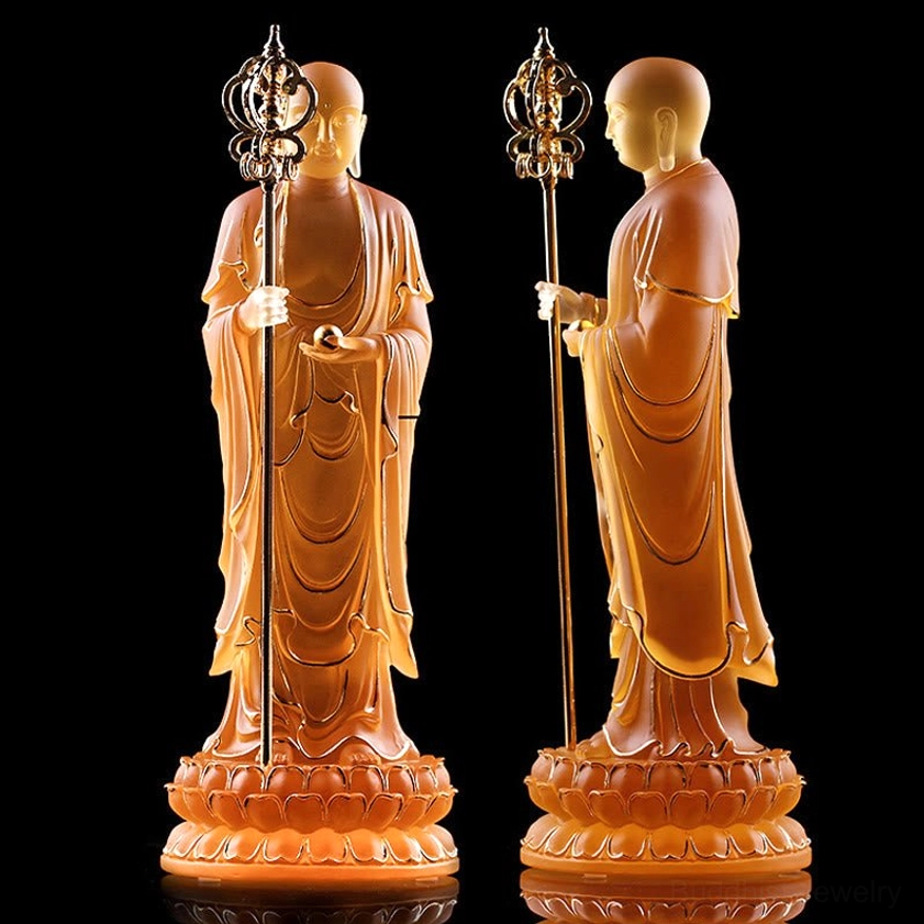 Pair of matching amber Ksitigarbha Bodhisattva liuli crystal statues viewed from rear showing identical craftsmanship