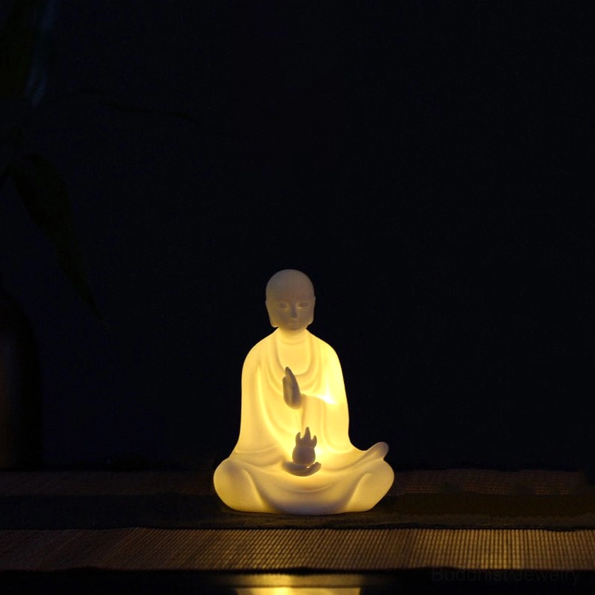 Ksitigarbha Bodhisattva handcrafted ceramic statue holding sacred relic with blessing hand gesture and serene expression