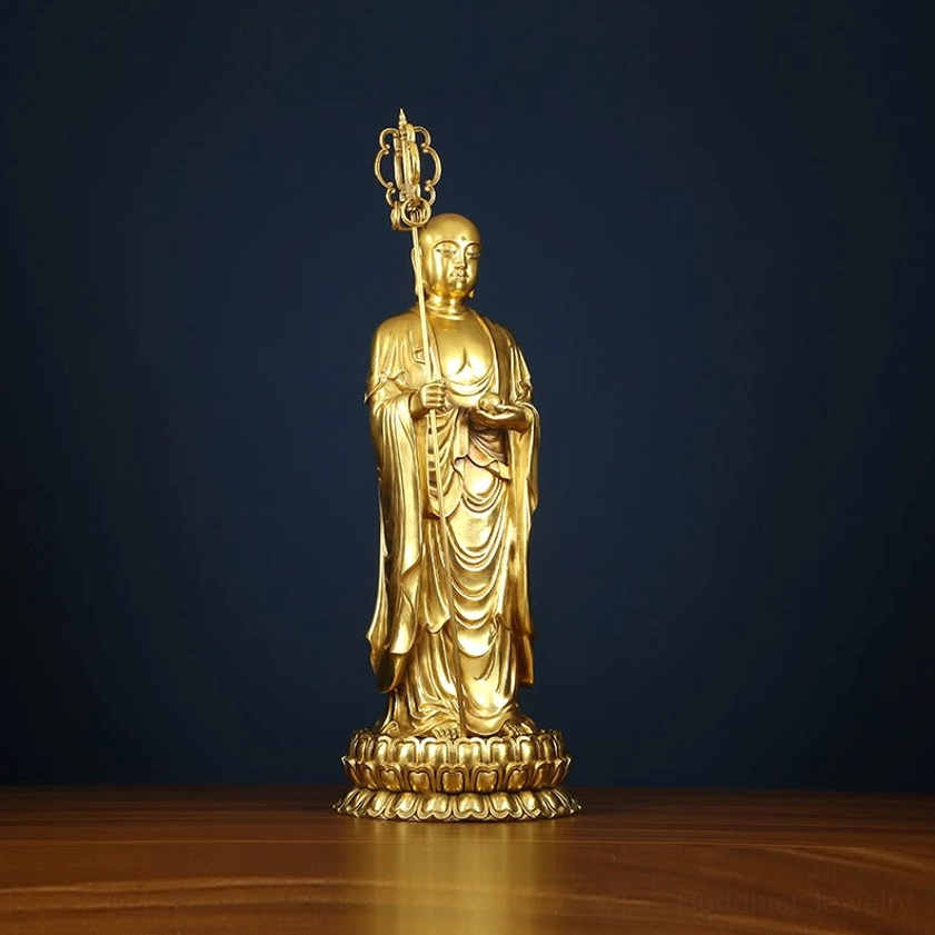 Ksitigarbha Bodhisattva statue left three-quarter front angle view showing smooth gold copper surface and intricate robes