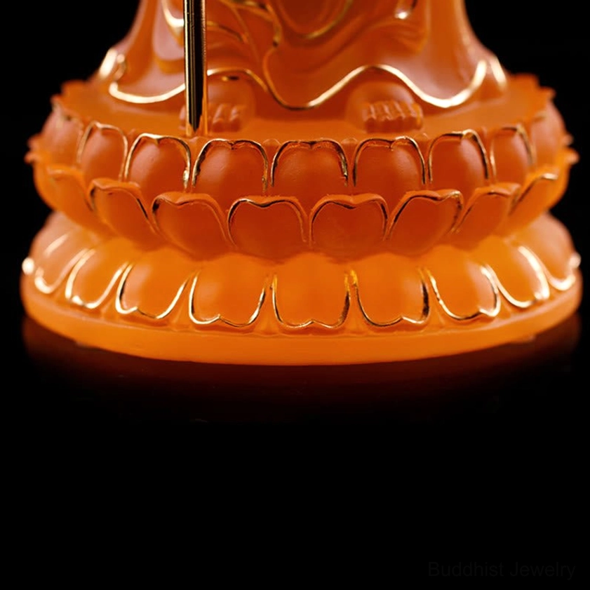 White and amber Ksitigarbha Bodhisattva liuli crystal statues comparing color variations and finishes