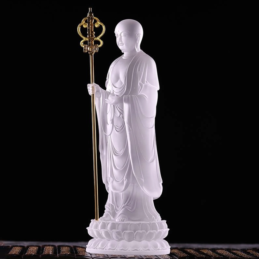 Left three-quarter view of white Ksitigarbha Bodhisattva liuli crystal showing robe details and lotus base