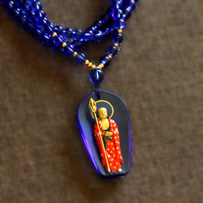 Dark blue Ksitigarbha Buddha liuli crystal standing pendant with gilded red Buddha and khakkhara, front view with beaded necklace chain