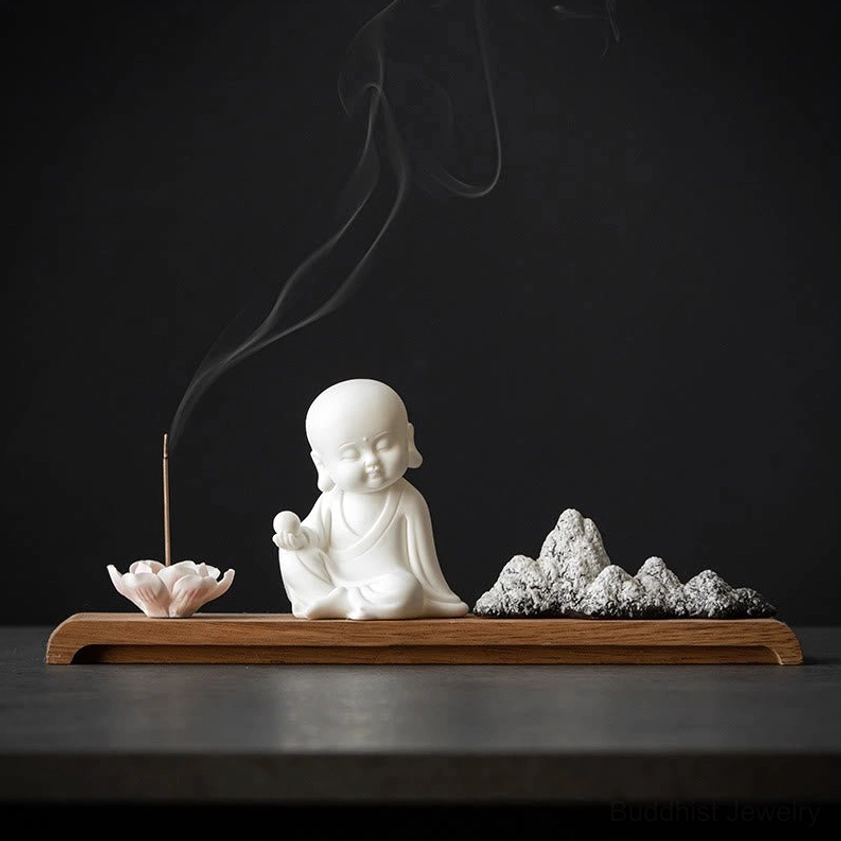 Ksitigarbha Earth Store Bodhisattva ceramic incense burner with lotus holder on wooden surface