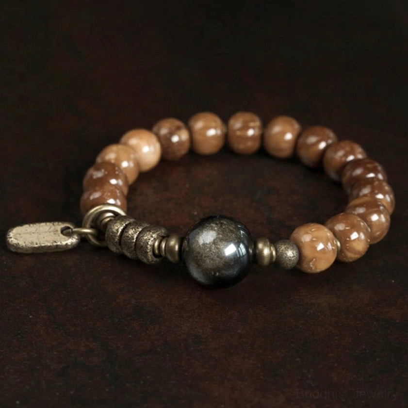 Beaded stretch bracelet with varied brown tones and large hematite focal bead