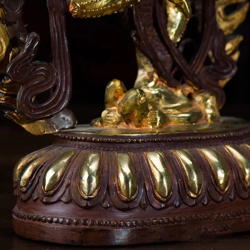Kurukulla fierce deity upper body close-up showing bow and arrows ornate arm ornaments and red lips detail