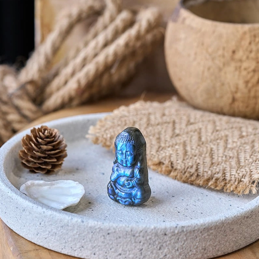 Mini labradorite Buddha figurine displayed on ceramic tray with natural boho home decor accessories