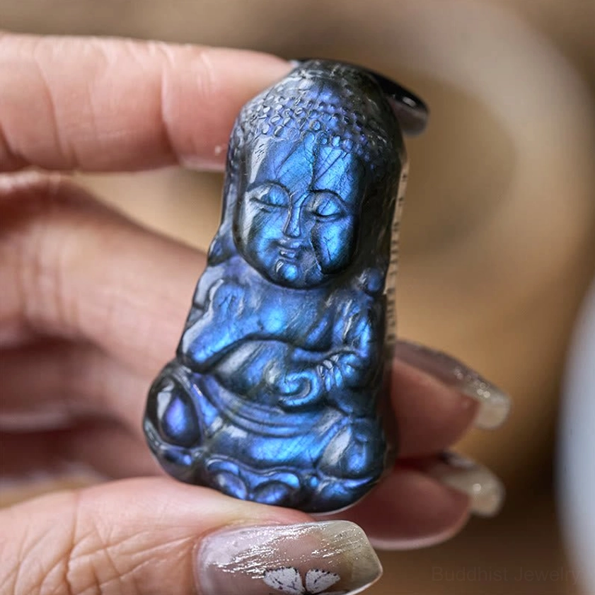 Close-up macro view of labradorite Buddha figurine highlighting striking blue labradorescence flash