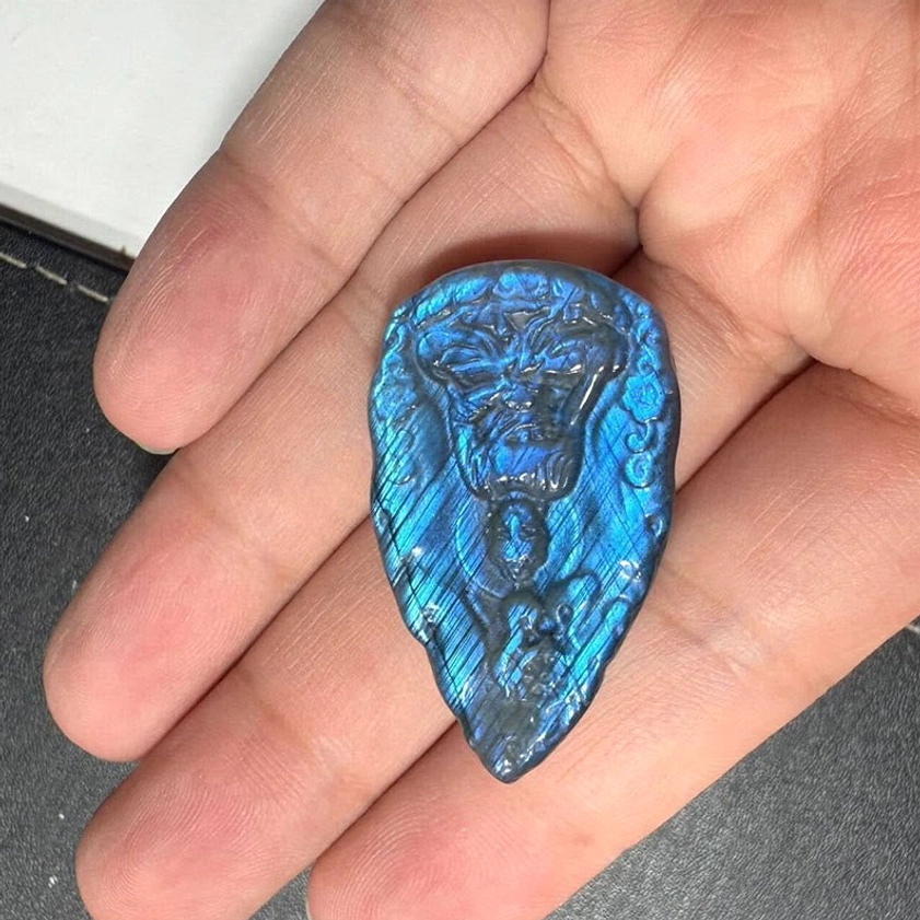 Labradorite Buddha figurine product photo showing natural stone texture, iridescent finish, and hand-carved Buddha details for meditation and spiritual practice