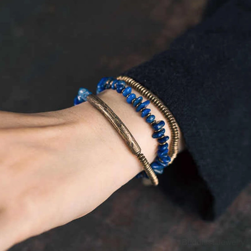 Lapis lazuli handmade bracelet showing authentic deep blue color with golden pyrite flecks and bronze metal accents