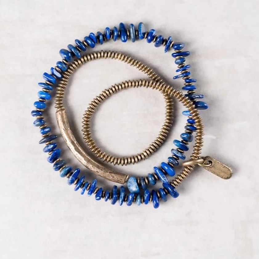 Flat lay display of lapis lazuli triple wrap bracelet set on white background, complete Buddhist crystal bracelet