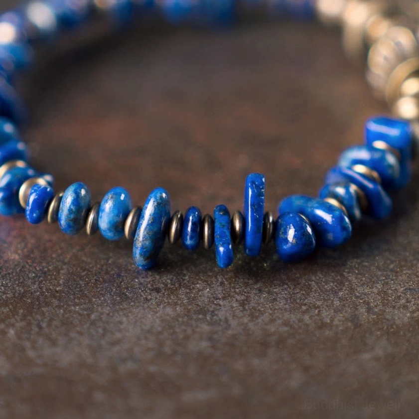 Extreme macro close-up of lapis lazuli chip beads and vintage metal spacer beads showing stone texture and detail