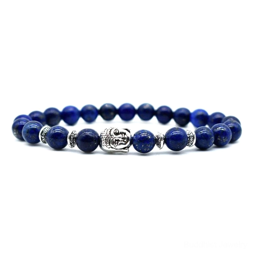 Lapis lazuli Buddhist healing bracelet with dark blue beads and silver Buddha head charms on gray background