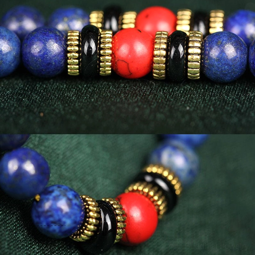 Macro close-up details of lapis lazuli mala beads showing indigo blue stone, gold spacer beads, black accent beads and large red decorative beads