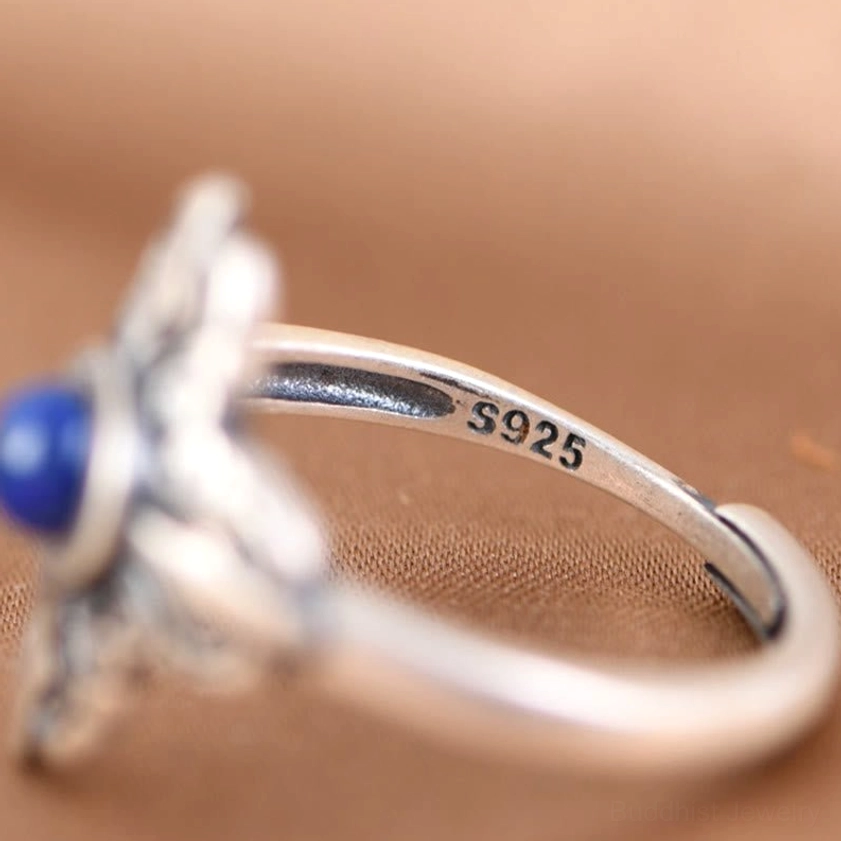 Inner band of sterling silver lapis lazuli ring, close-up showing S925 hallmark stamp and open adjustable design