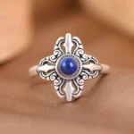 925 sterling silver lapis lazuli adjustable ring with vajra cross design, top-down view showing deep blue stone with golden pyrite