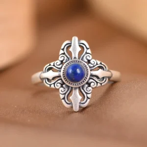 925 sterling silver lapis lazuli adjustable ring with vajra cross design, top-down view showing deep blue stone with golden pyrite
