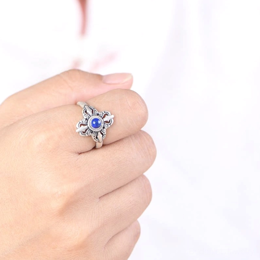 Lapis lazuli ring worn on middle finger, showing perfect fit and delicate silver metalwork on hand
