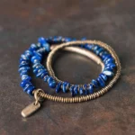 Lapis lazuli triple wrap bracelet with antiqued bronze beads and hanging charm tag, handmade Buddhist crystal bracelet for balance