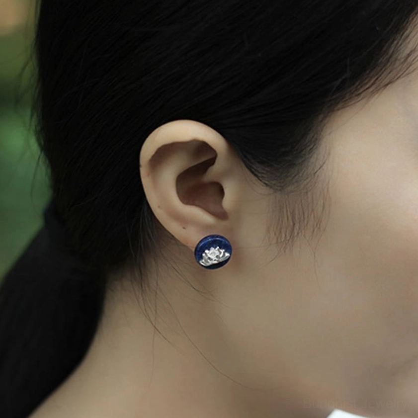 Lotus stud earrings worn on earlobe demonstrating fit and size worn on body