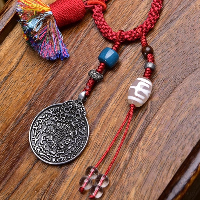 Large hand-painted Dzi Bead focal point on Buddhist keychain with red rope and ornate silver charm