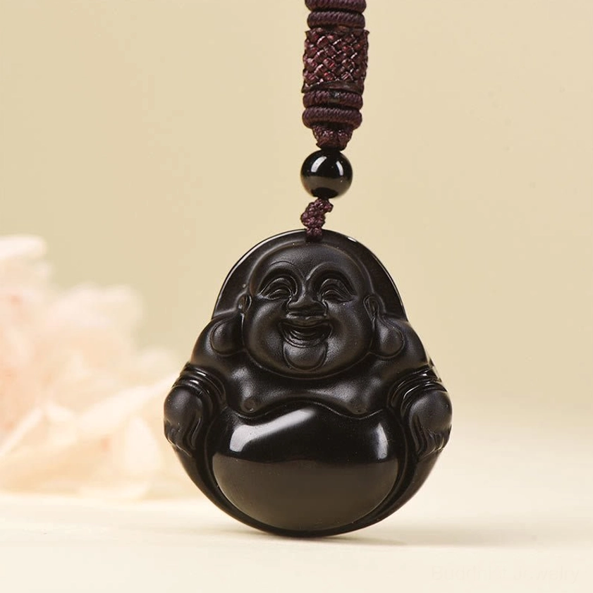 Large laughing Buddha obsidian pendant close-up with detailed carving and polished dark finish