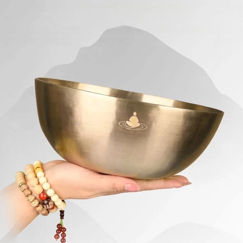 Large handmade singing bowl held in hands with wrist display, demonstrating authentic copper meditation bowl weight and size