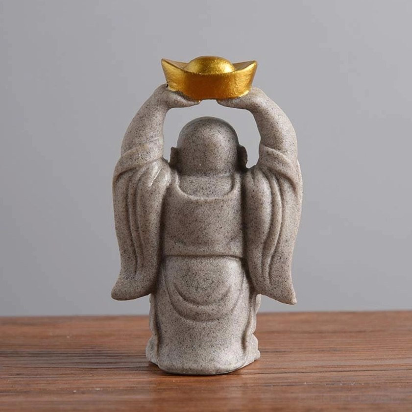 Laughing Buddha statue back view holding golden ingot overhead, handmade resin sculpture showing craftsmanship details