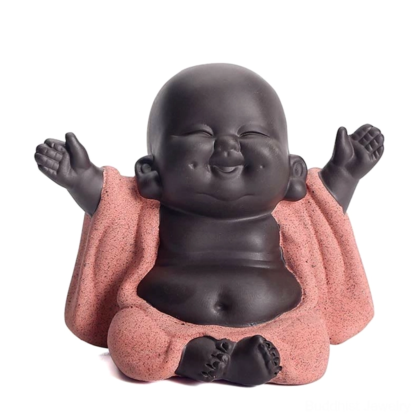Close-up happy Buddha statue with extreme front view on white background, facial features and robe texture detail