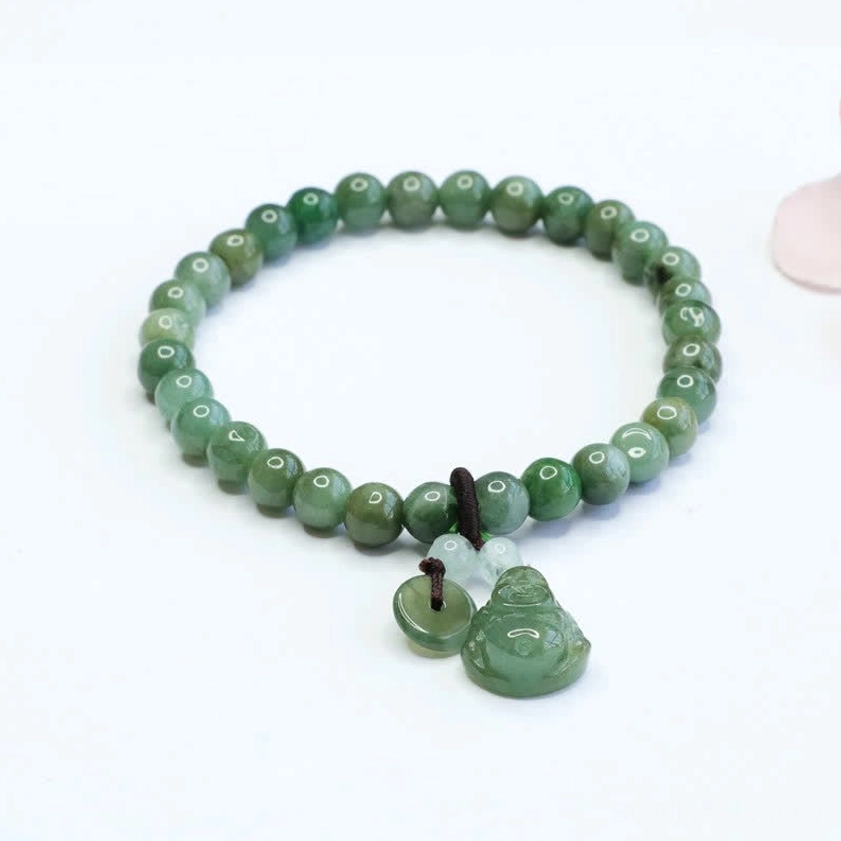 Laughing Buddha Cyan Jade bracelet with hand-carved Buddha charm and 6mm round green jade beads on premium elastic string, overhead flat lay view