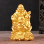 Laughing Buddha feng shui toad statue with copper coins base golden finish front view