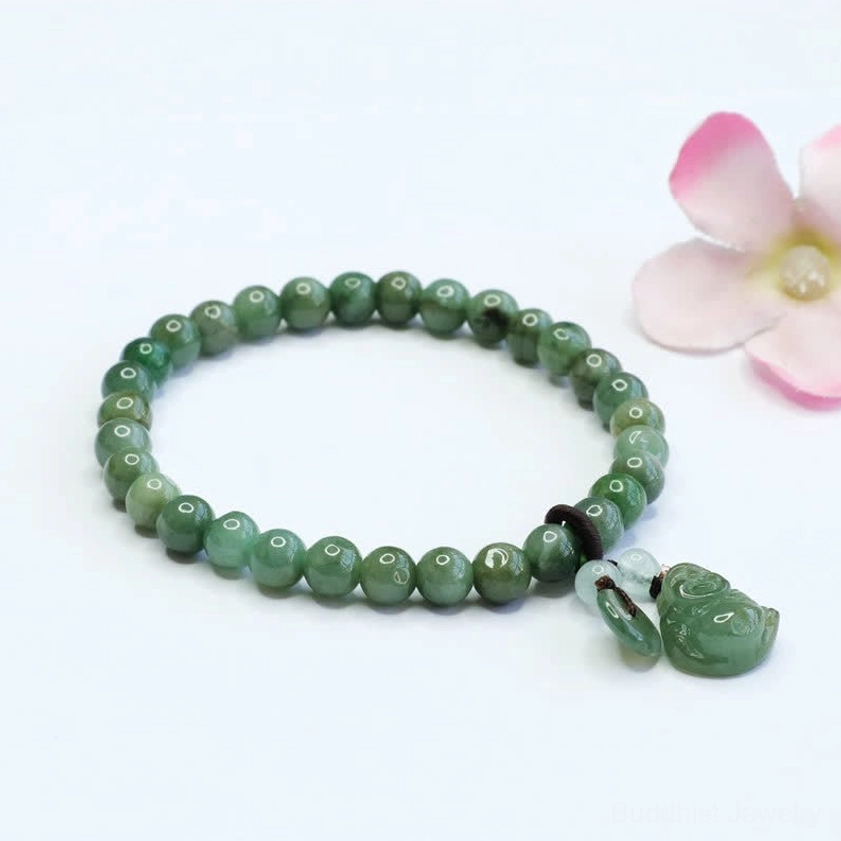Laughing Buddha Cyan Jade bracelet with carved Buddha charm and round green jade beads arranged with pink flower decorations