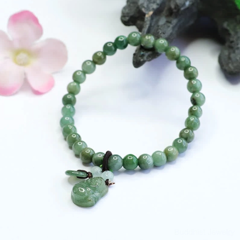 Cyan Jade Laughing Buddha spiritual bracelet for joy and balance featuring uniform round jade beads with hand-carved Buddha pendant