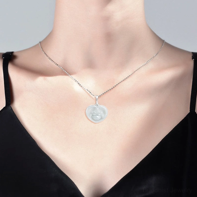 White jade laughing Buddha heart pendant necklace worn at collarbone, styled on model showing elegant wear