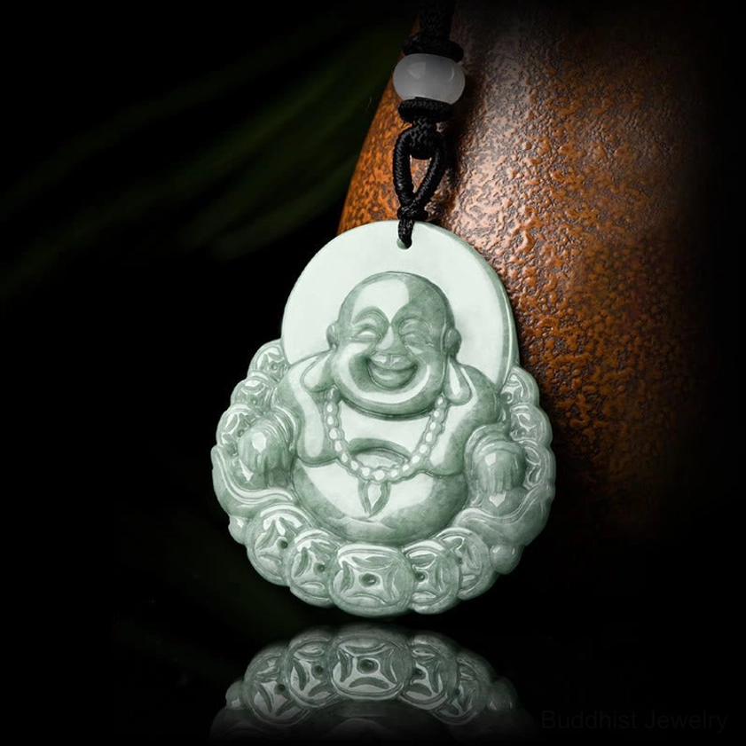 Laughing Buddha jade pendant on black necklace cord with white bead accent displayed on dark background