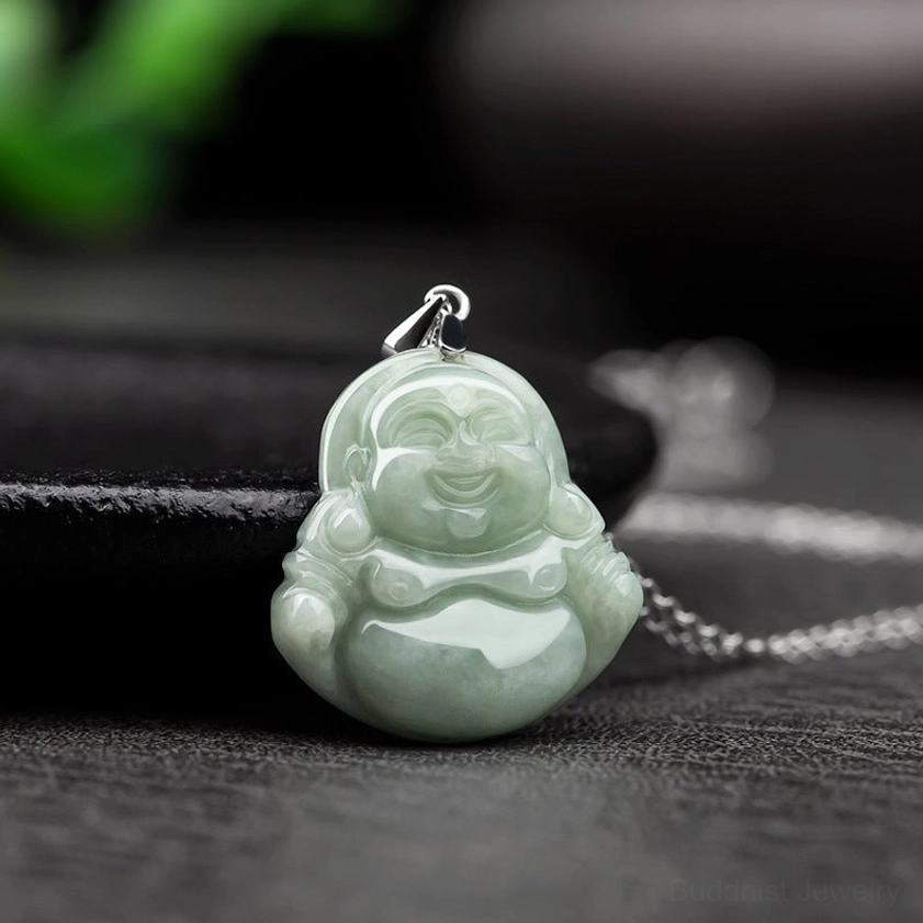 Jade Maitreya Buddha necklace side overhead shot showing pale cyan jade pendant with attached silver chain and metal buckle clasp